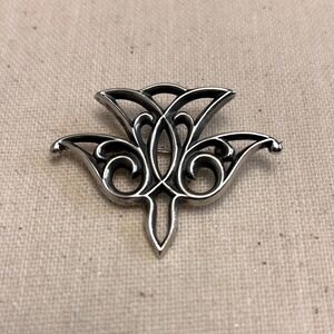 Retired James Avery descending Dove brooch